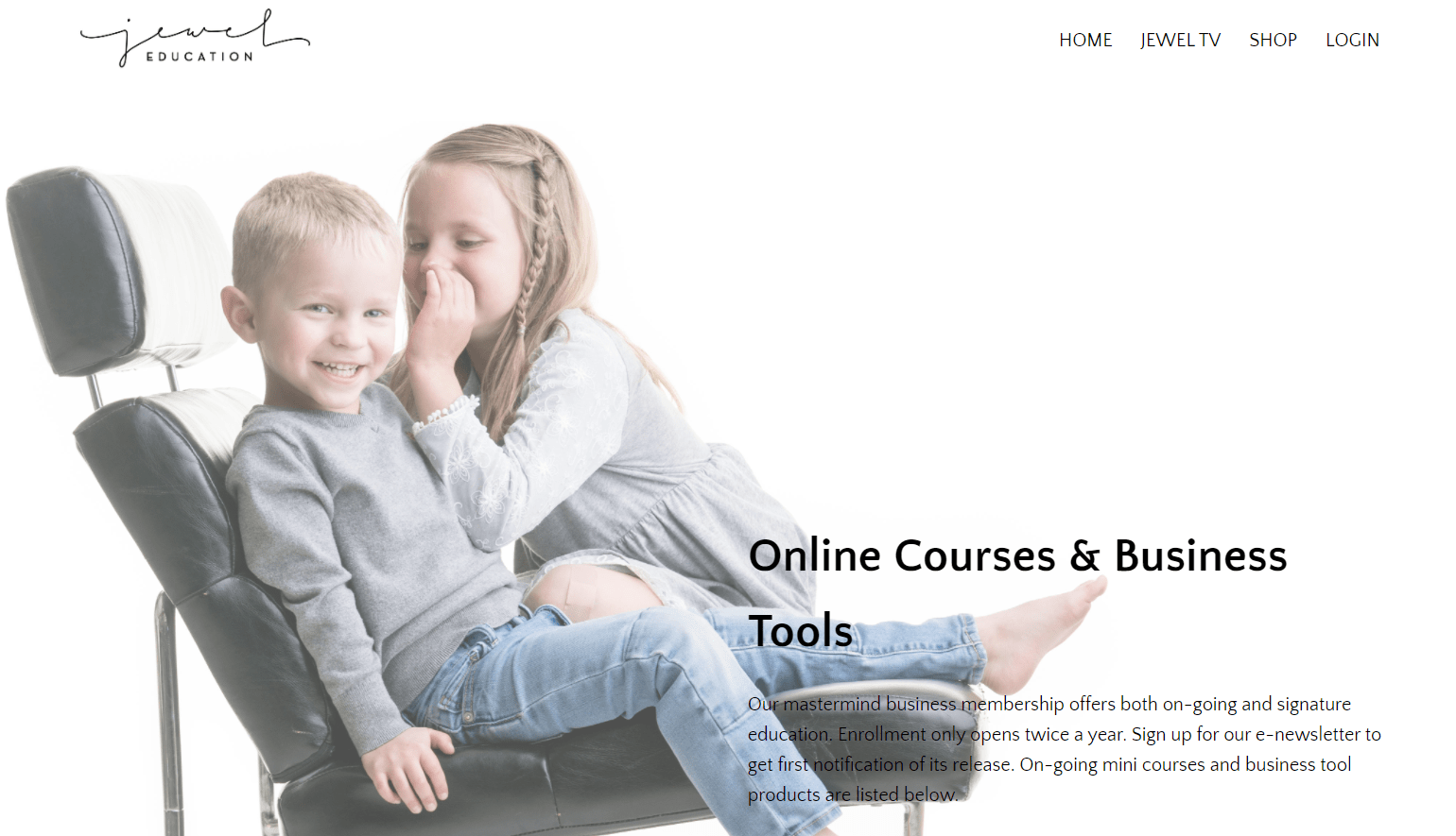 The Jewel Education website with an image of two young children in a black leather chair