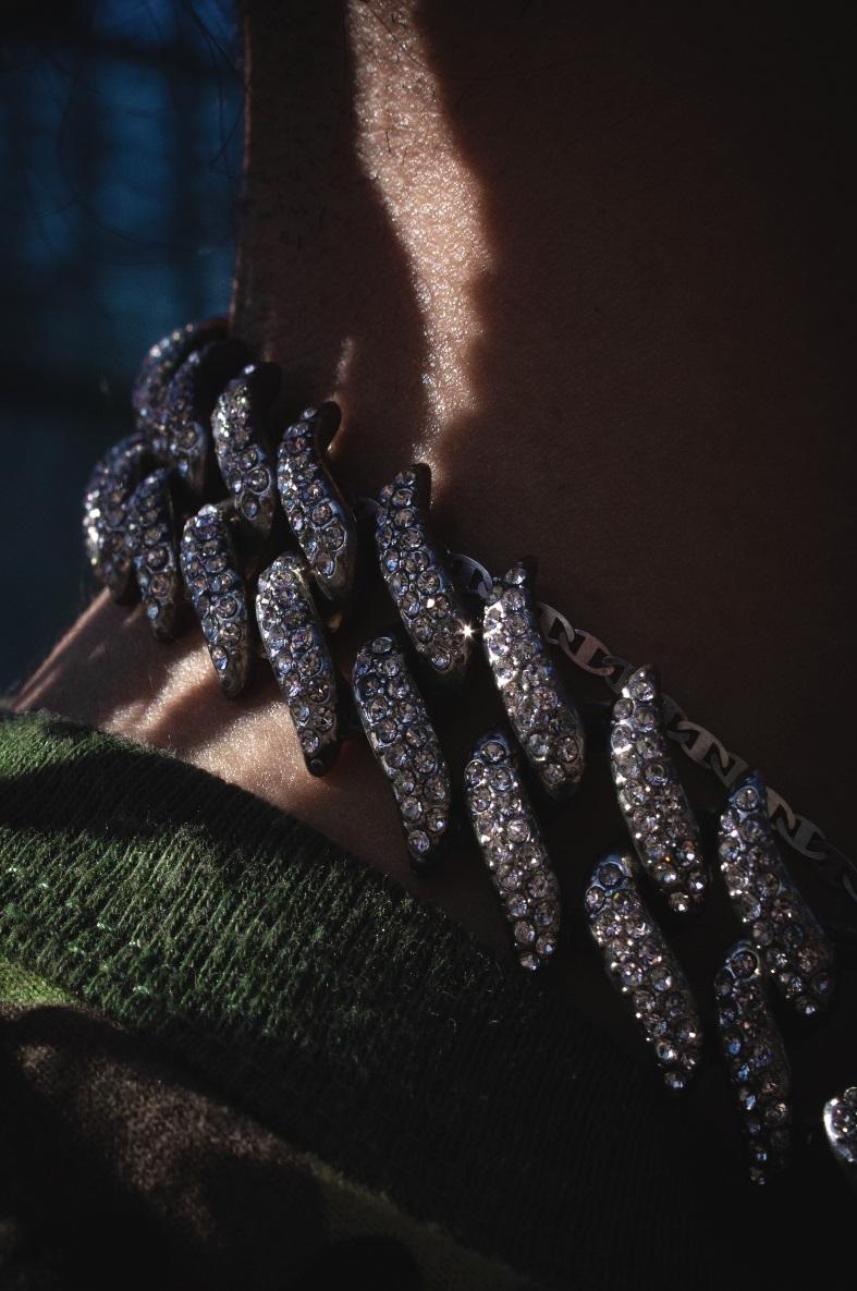 silver necklace on white textile - Diamond Chains